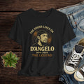 Black t-shirt with D'Angelo graphic design on a wooden surface with jeans and sneakers.