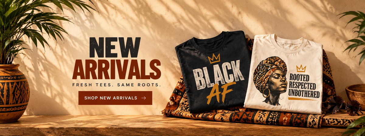 Two graphic T-shirts displayed on a patterned textile on a wooden surface, with a warm beige background and leaf shadows. The left shirt is black with 'BLACK AF' in white and gold, and the right shirt is white with a portrait graphic and the text 'ROOTED RESPECTED UNBOTHERED'.